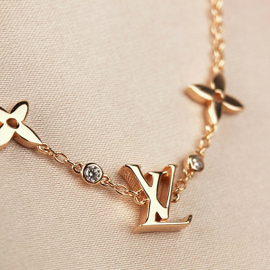 GlowSTAR AND SUN 7 MOTIFS GOLD BRACELET
