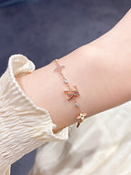 GlowSTAR AND SUN 7 MOTIFS GOLD BRACELET