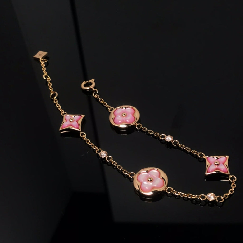 GlowSTAR AND SUN 4 MOTIF PINK MOP PINK GOLD BRACELET