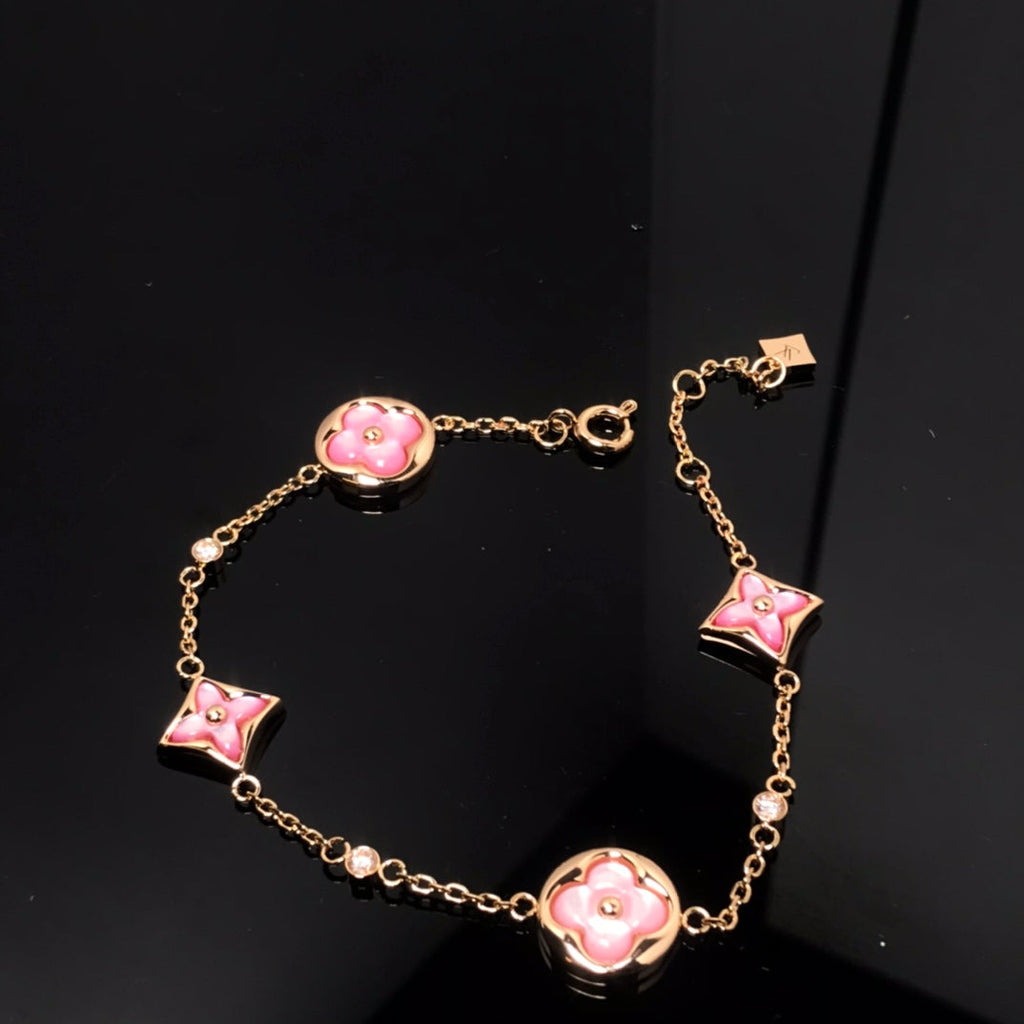 GlowSTAR AND SUN 4 MOTIF PINK MOP PINK GOLD BRACELET