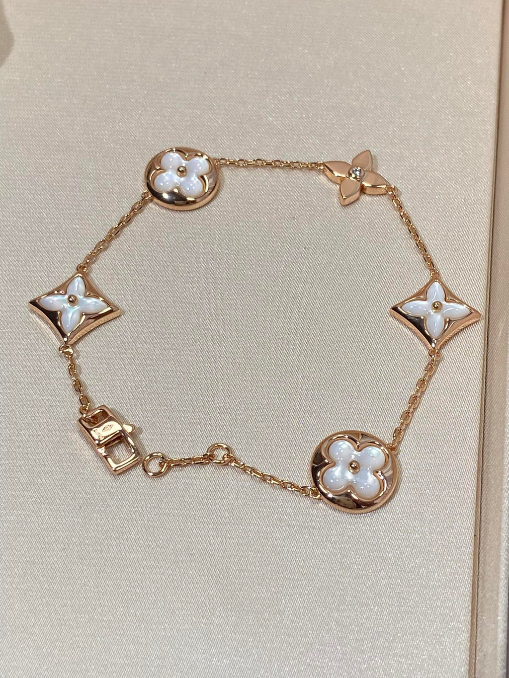 GlowSTAR AND SUN 5 MOTIF MOP PINK GOLD BRACELET