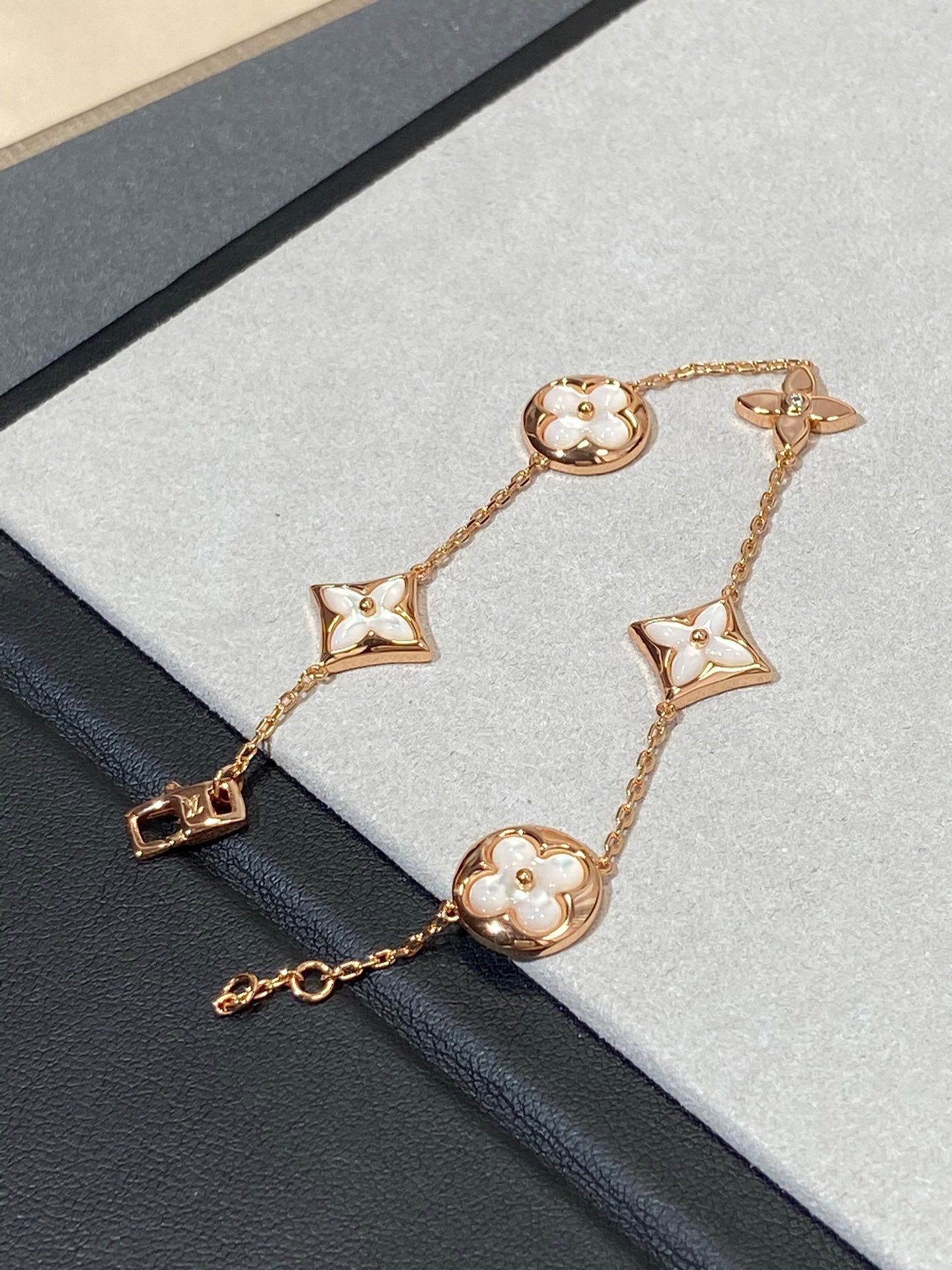 GlowSTAR AND SUN 5 MOTIF MOP PINK GOLD BRACELET