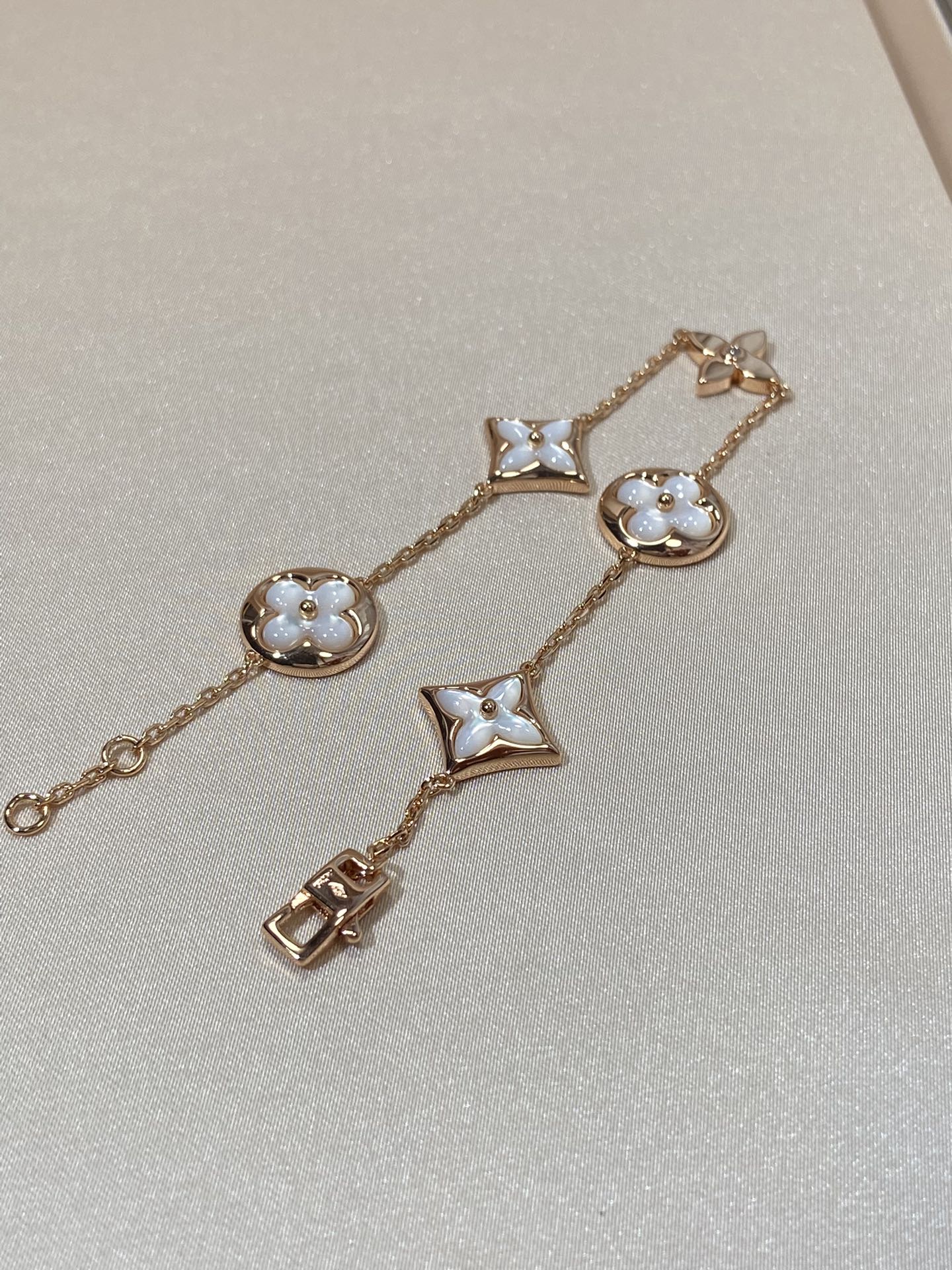 GlowSTAR AND SUN 5 MOTIF MOP PINK GOLD BRACELET