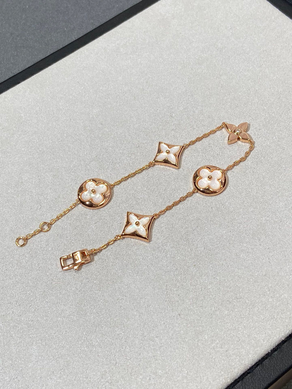 GlowSTAR AND SUN 5 MOTIF MOP PINK GOLD BRACELET