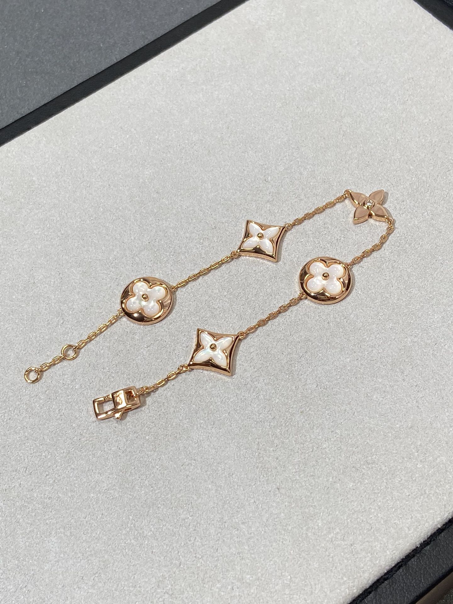 GlowSTAR AND SUN 5 MOTIF MOP PINK GOLD BRACELET