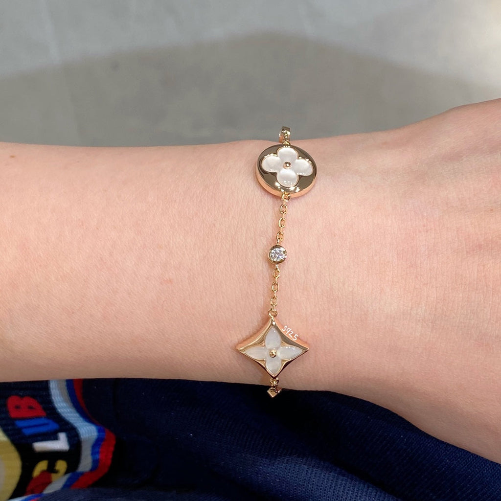 GlowSTAR AND SUN 4 MOTIF WHITE MOP PINK GOLD BRACELET