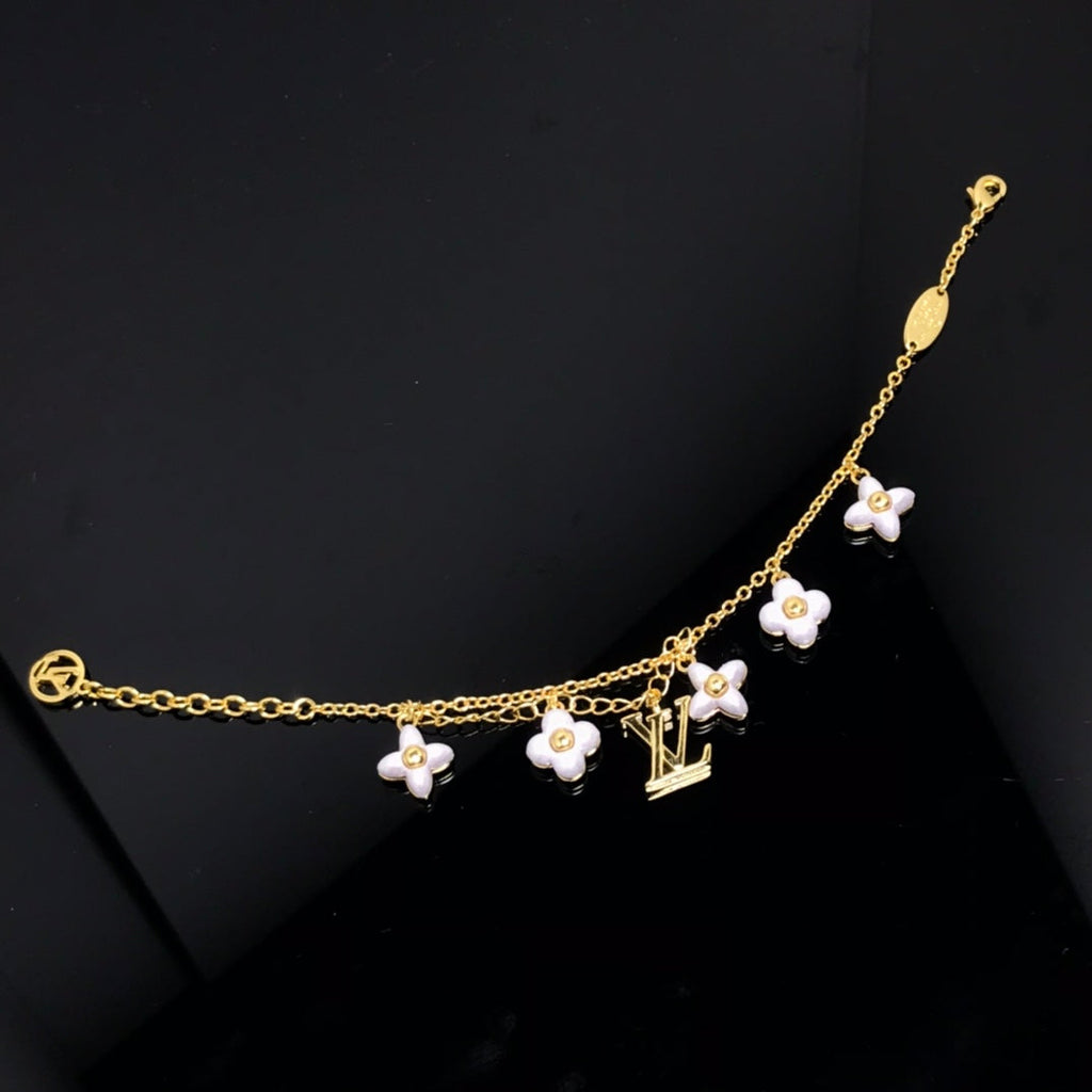 GlowLOGO 6 MOTIF STAR AND SUN GOLD BRACELET