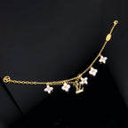 GlowLOGO 6 MOTIF STAR AND SUN GOLD BRACELET