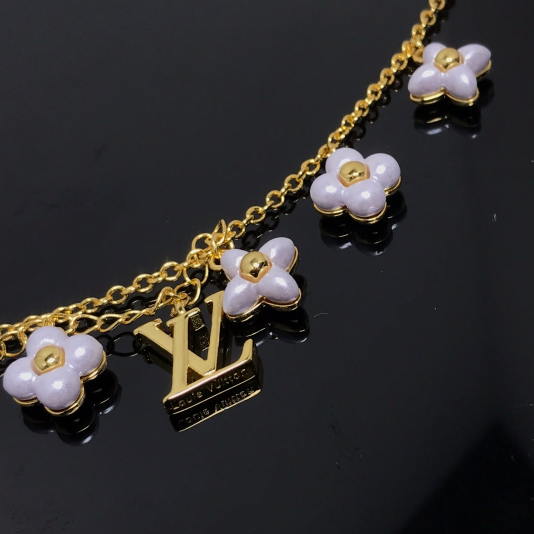 GlowLOGO 6 MOTIF STAR AND SUN GOLD BRACELET