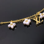GlowLOGO 6 MOTIF STAR AND SUN GOLD BRACELET