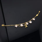 GlowLOGO 6 MOTIF STAR AND SUN GOLD BRACELET
